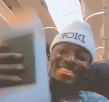 Sidiki Camara on plane